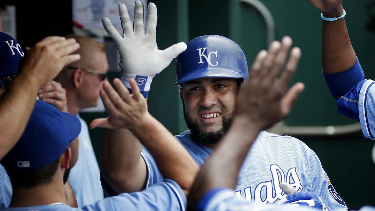 Kendrys Morales celebrates with Royals teammates in the dugout after hitting a two-run home run against the White Sox on Aug. 9.