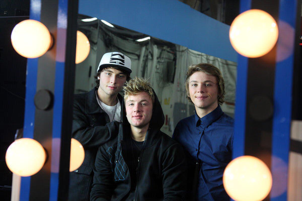 Emblem3 photographed on the CBS lot in Los Angeles on December 10, 2012. They are, left to right, Wesley Stromberg, Drew Chadwick and Keaton Stromberg.