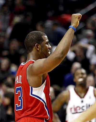 Clippers point guard Chris Paul begins to celebrate after helping L.A. defeat the Trail Blazers, 74-71, with a strong fourth-quarter performance on Thursday night at the Rose Garden in Portland.