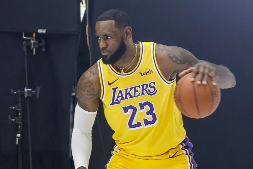 Los Angeles Lakers forward LeBron James poses for photos during the NBA basketball team's media day in El Segundo, Calif., Friday, Sept. 27, 2019. (AP Photo/Ringo H.W. Chiu)