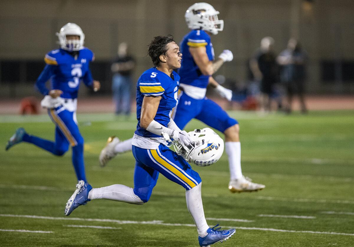 Fountain Valley's Adrian Esquivel and teammates celebrate after getting a stop against Aliso Niguel in the final seconds.