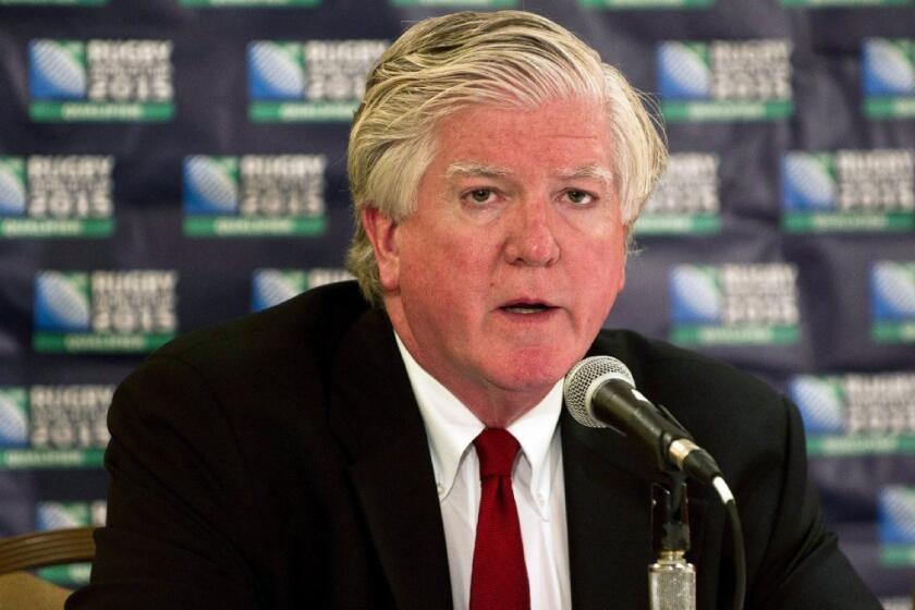 Brian Burke speaks at a news conference in Toronto on Aug. 22.