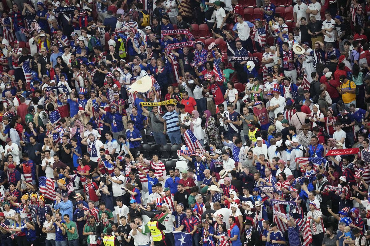 Fans from the United States cheer 