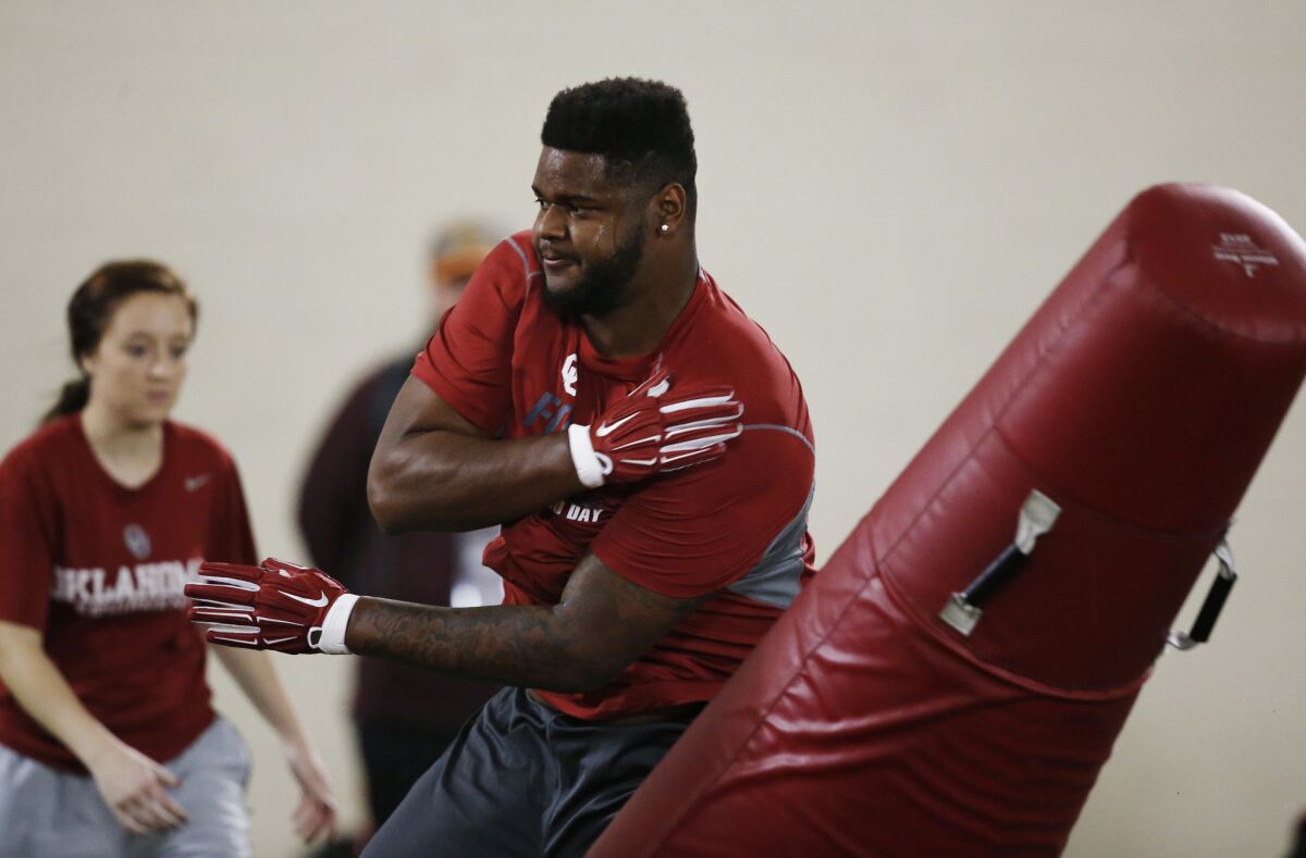 Defensive tackle Jordan Phillips works out for NFL scouts during Oklahoma's pro day on March 11.