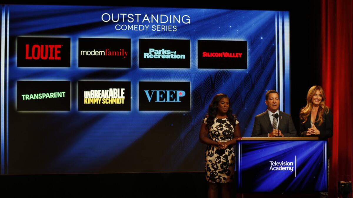 Uzo Aduba, left, Television Academy Chairman and CEO Bruce Rosenblum and Cat Deeley announce the nominees for the Emmys. The announcement was pushed back three hours from its former 5:30 a.m. start.