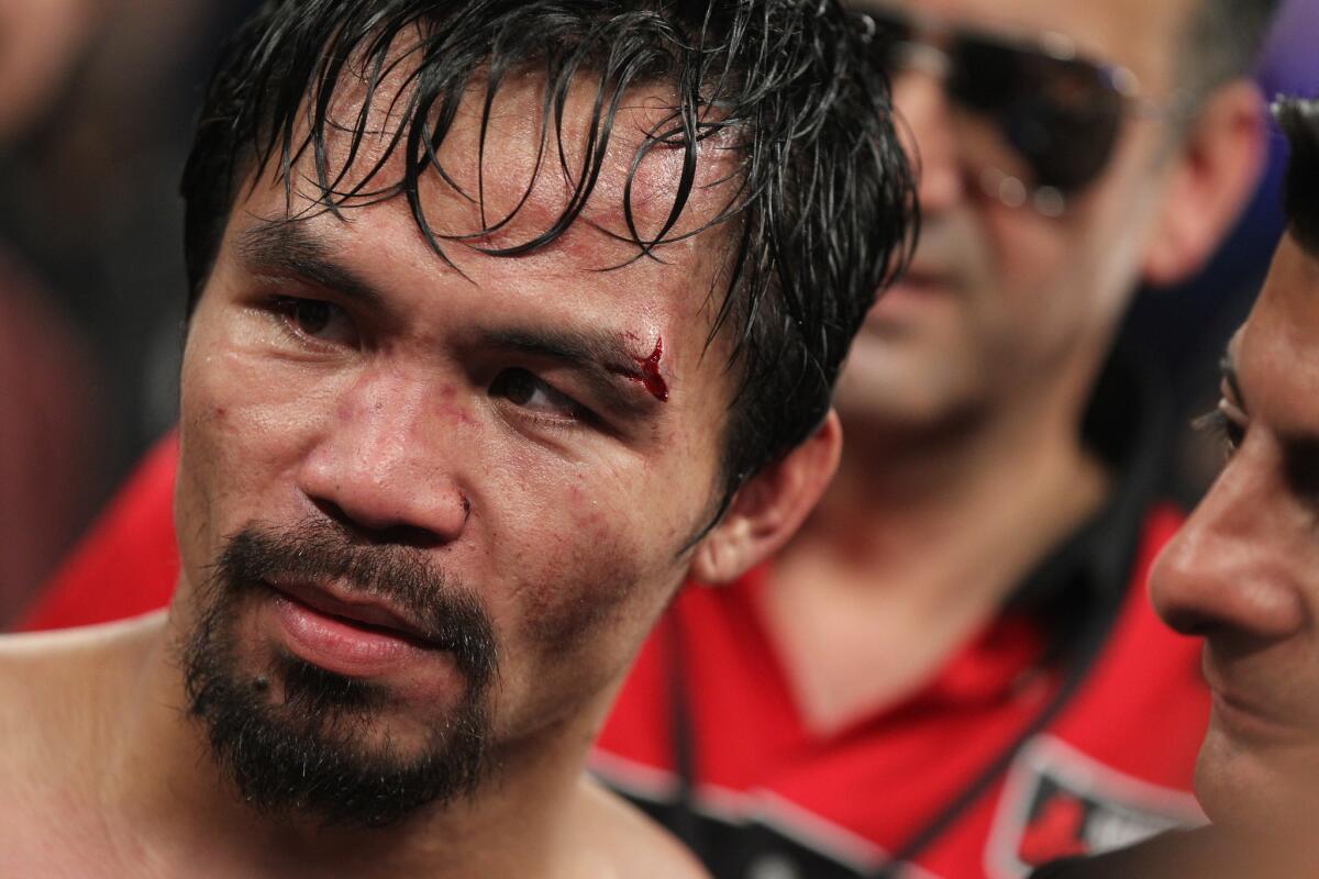 Manny Pacquiao stands in the ring following his victory over Timothy Bradley back in April.