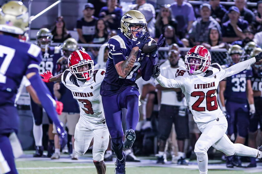 Kuika Moaalii, a 6-foot-5 sophomore, makes tough catch for St. John Bosco. He had four catches for 119 yards.