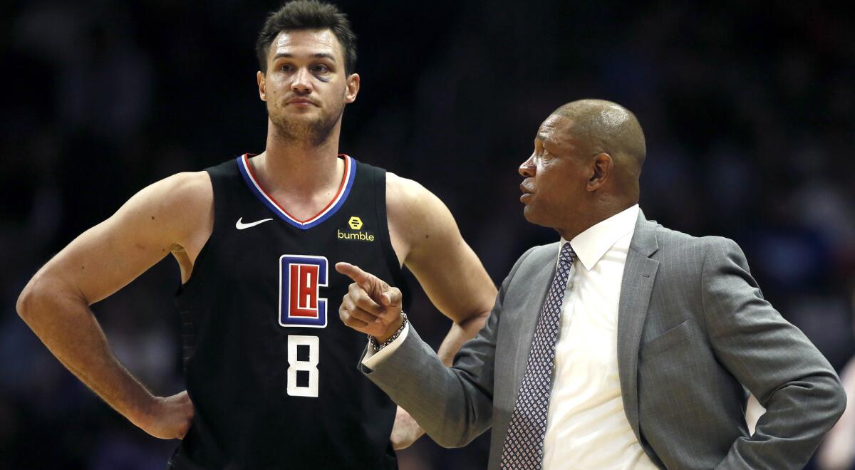 Coach Doc Rivers and high-scoring forward Danilo Gallinari chat during a break in play earlier this season.