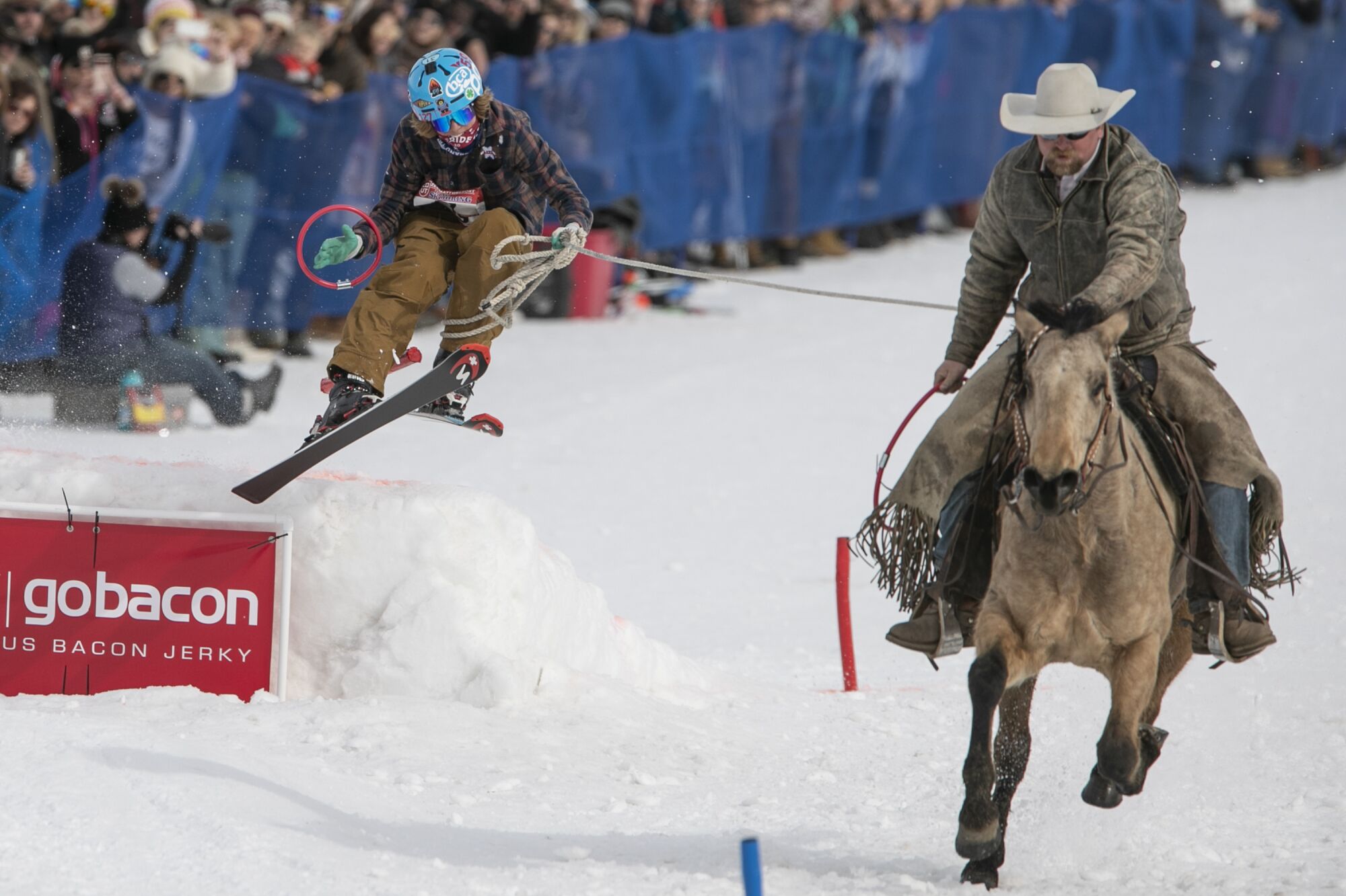 Carl Verhaaren, behind Howard Hutchings on Josephine, competes in the Pro/Open Division of Skijoring Utah at Soldier Hollow Nordic Center.