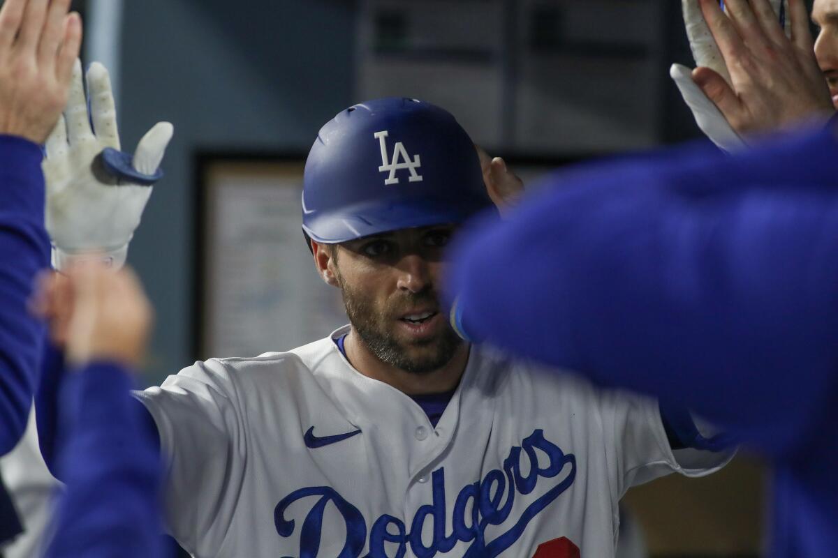 Chris Taylor celebrates in the dugout after hitting a solo home run in the second inning Friday.