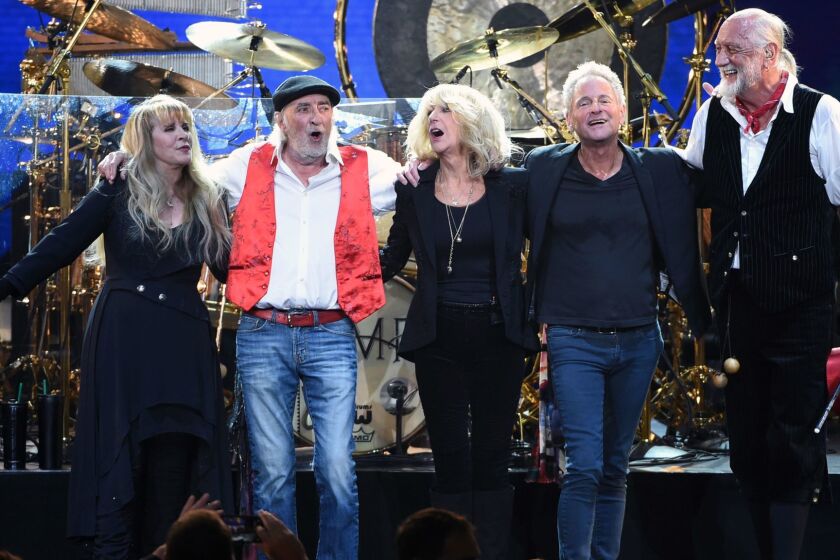 Fleetwood Mac band members take a bow, from left, Stevie Nicks, John McVie, Christine McVie, Lindsey Buckingham and Mick Fleetwood at the 2018 MusiCares Person of the Year tribute honoring Fleetwood Mac at Radio City Music Hall on Friday, Jan. 26, 2018, in New York. (Photo by Evan Agostini/Invision/AP)