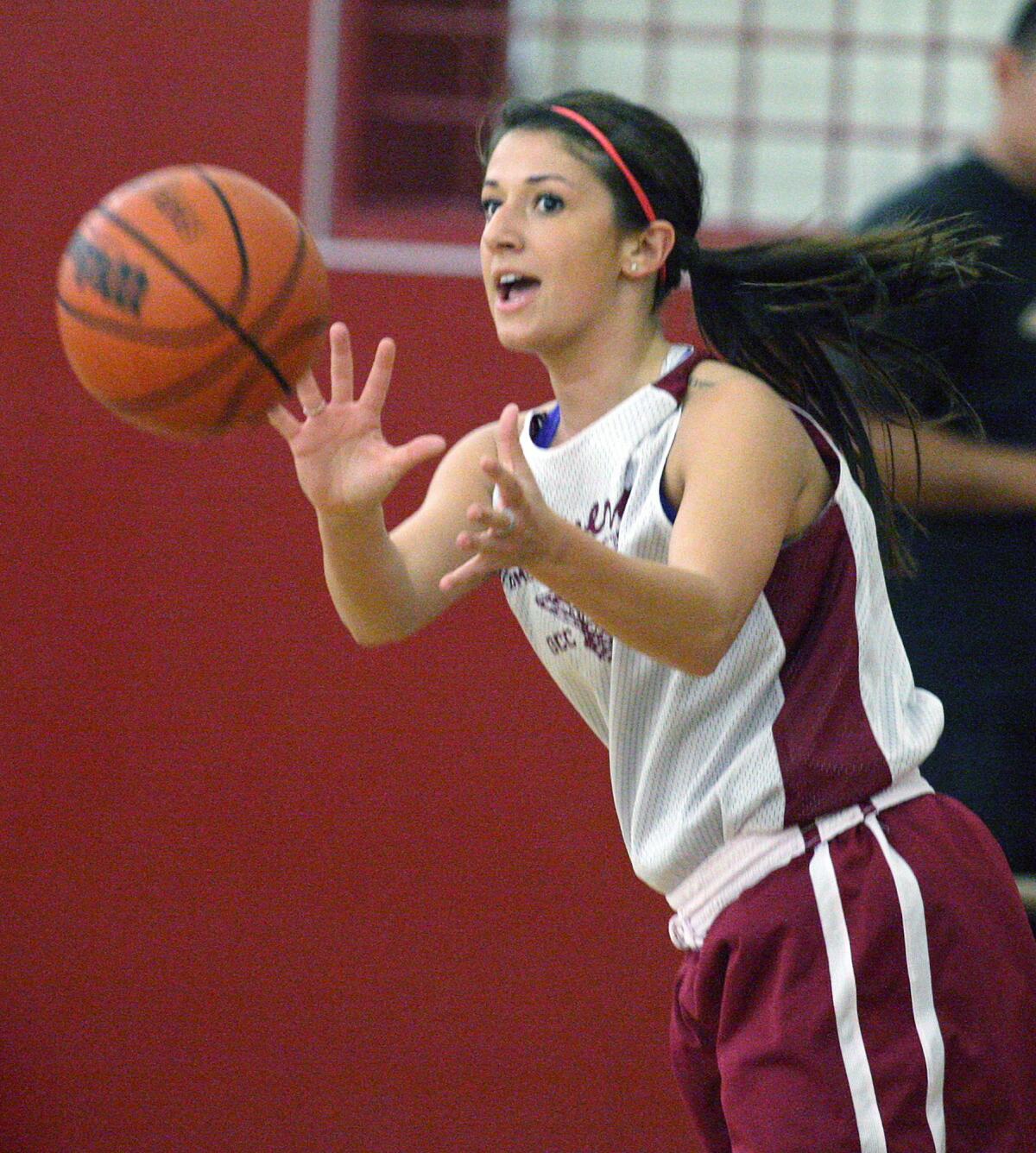 Glendale College's Nicole Pappelis receives a pass during the women's basketball team practice on campus in the Verdugo Gym on Tuesday, Nov. 5, 2013.