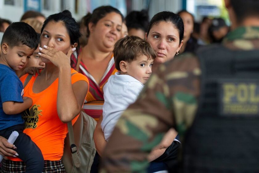 Venezuelan migrants wait to get a refugee application at the Peruvian border post at the binational border attention centre (CEBAF) in Tumbes on early June 14, 2019. - Some 6,000 Venezuelans have entered to Peru in the last two days, twice of the daily flow, as starting on June 15, 2019, Peru will require a humanitarian visa, in addition to the passport, to all Venezuelan citizens who wish to enter the country alleging security reasons. (Photo by Cris BOURONCLE / AFP)CRIS BOURONCLE/AFP/Getty Images ** OUTS - ELSENT, FPG, CM - OUTS * NM, PH, VA if sourced by CT, LA or MoD **