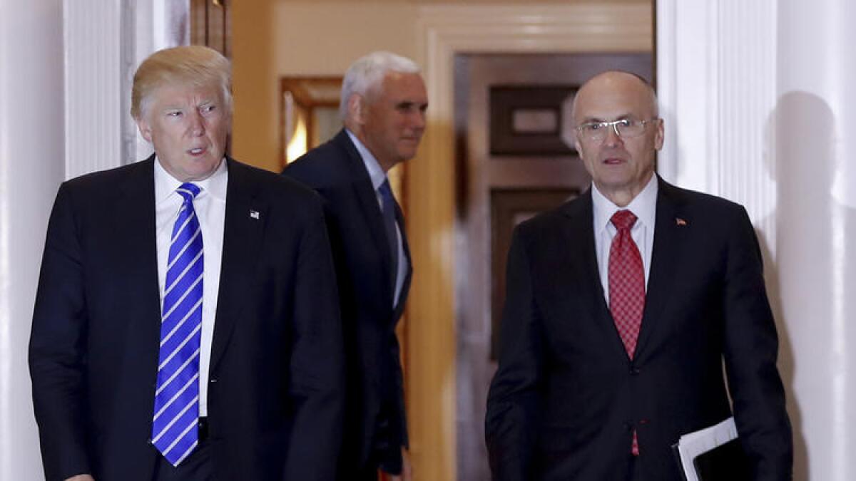 President Trump and his Labor secretary nominee, Andy Puzder, right, on Nov. 19.