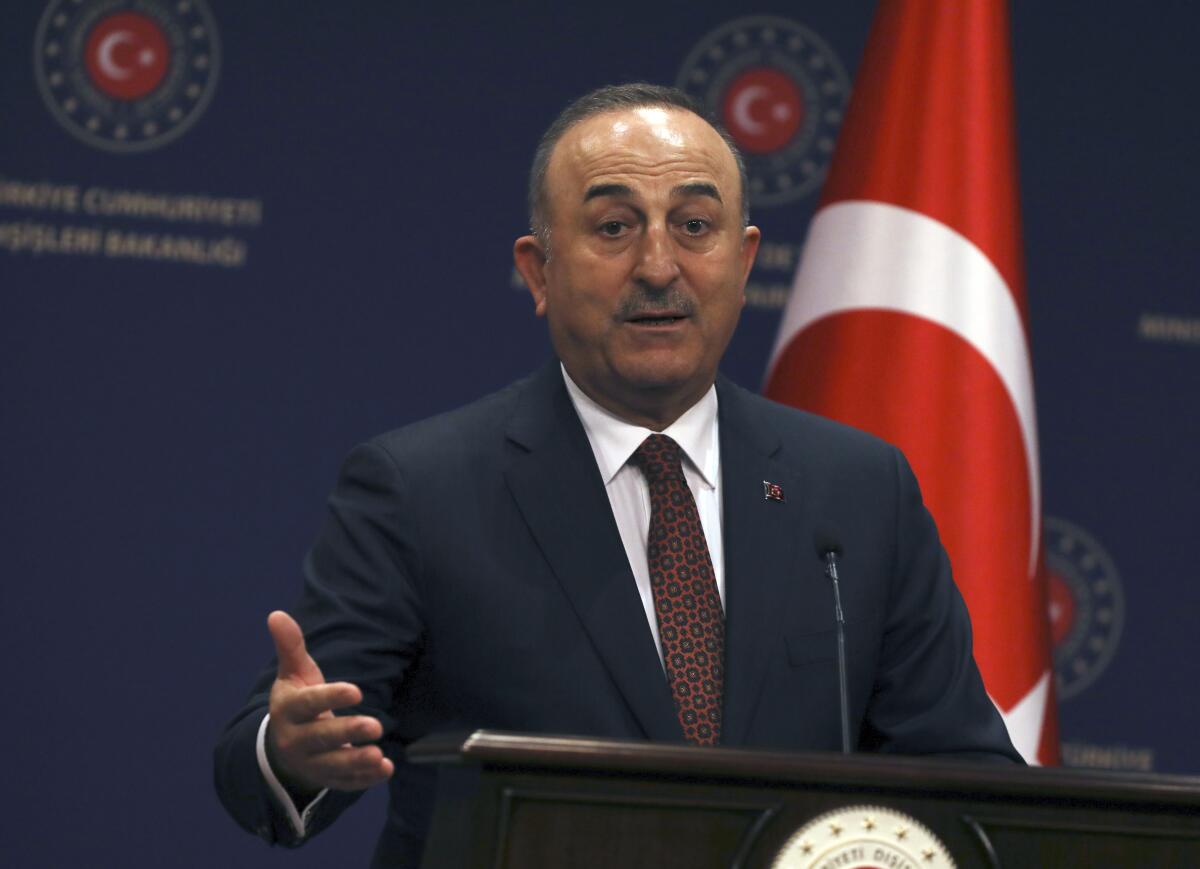 Turkish Foreign Minister Mevlut Cavusoglu speaks at a press conference in Ankara, Turkey, Thursday, Jan. 26, 2023. Cavusoglu on Thursday accused Sweden of being complicit in a "hate and racist crime" for failing to prevent weekend protests in Stockholm by an anti-Islam and pro-Kurdish groups. Cavusoglu also confirmed that a key meeting in Brussels to discuss Sweden and Finland's NATO membership, has been postponed saying such a meeting would have been "meaningless" in the wake of the protests.(AP Photo/Burhan Ozbilici)