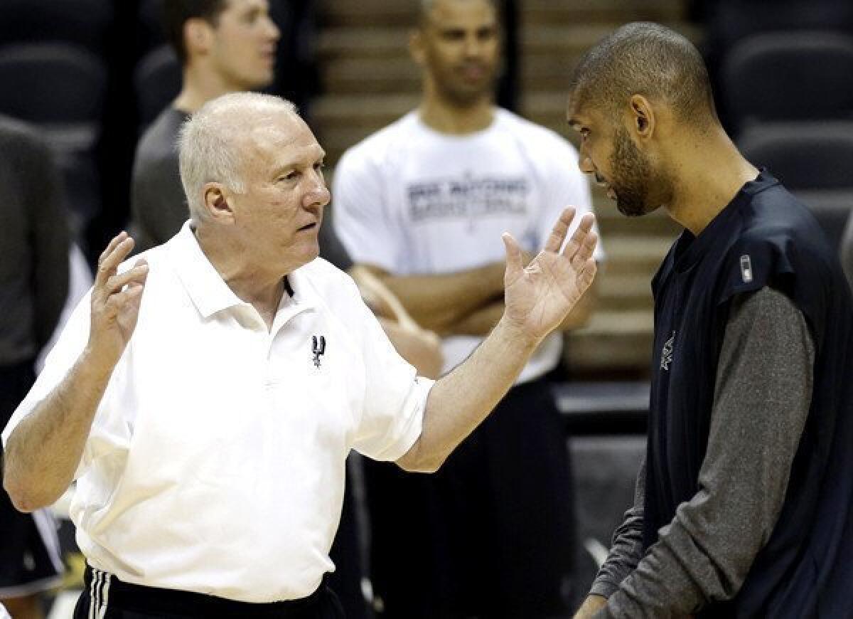 Two contants in the Spurs' success the last 15 years: Coach Gregg Popovich, left, and power forward Tim Duncan.
