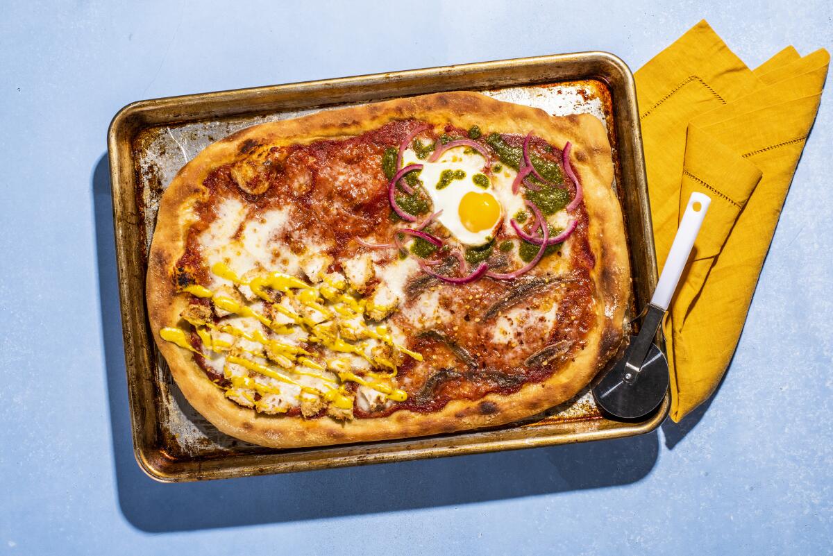 Pizza with a variety of toppings, including fried egg.
