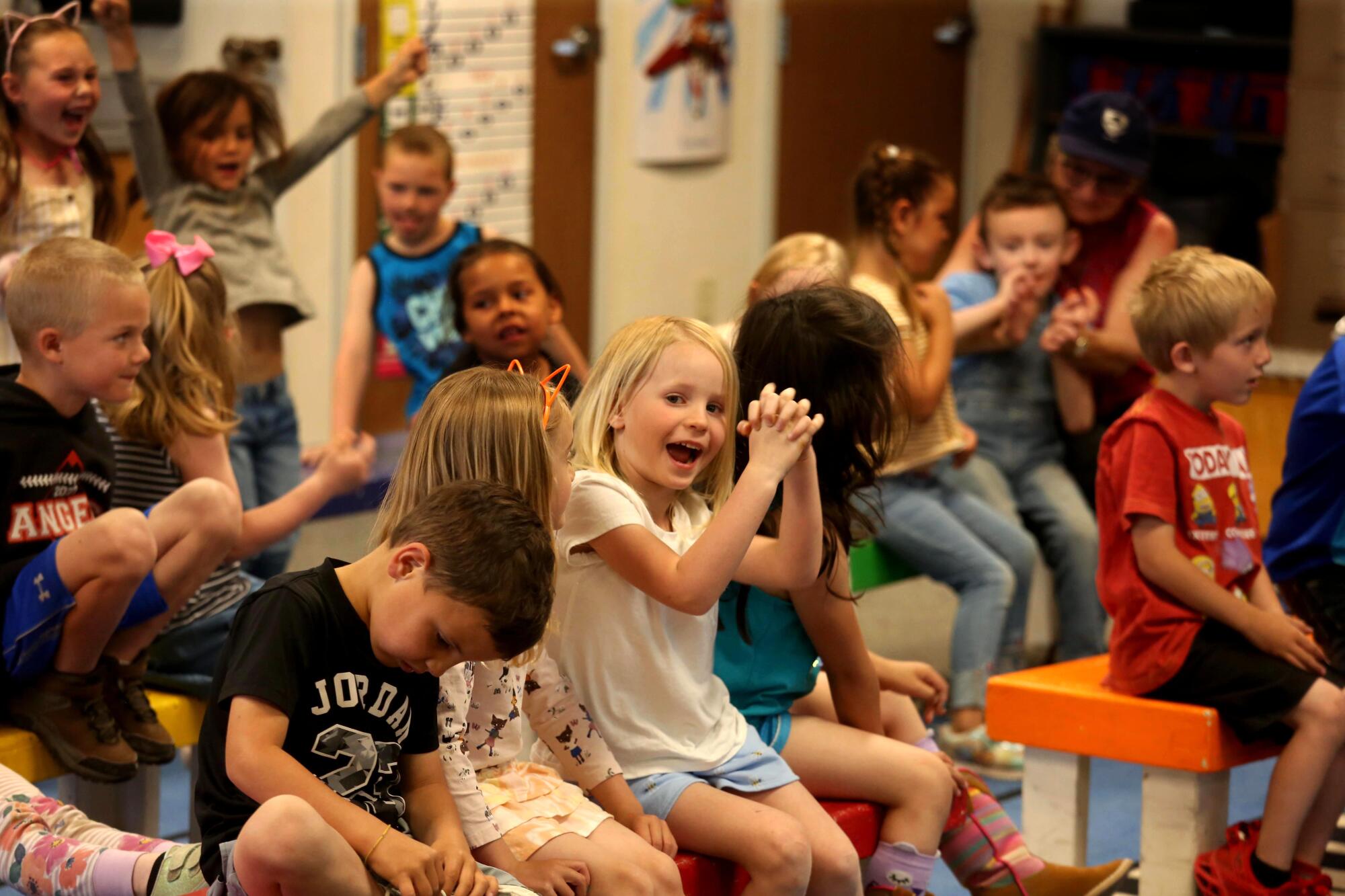 Students in a combined TK and kindergarten class participate in a singing exercise at Alturas Elementary School.