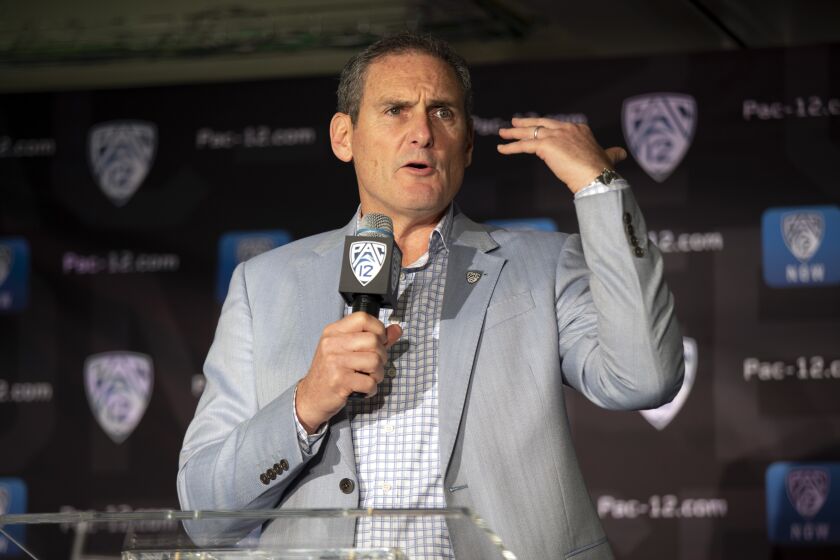 FILE - In this Oct. 8, 2019, file photo, commissioner Larry Scott speaks during the Pac-12 NCAA college basketball media day, in San Francisco. A Pac-12 team has made the College Football Playoff just twice in six seasons and none of the last three. If anyone should be leading the charge toward expanding the current four-team model, you would think it would be Pac-12 Commissioner Larry Scott. (AP Photo/D. Ross Cameron, File)