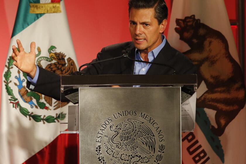 Mexico's President Enrique Pena Nieto speaks to Mexican American community leaders and others in Los Angeles on Aug. 25 during a two-day visit to California.