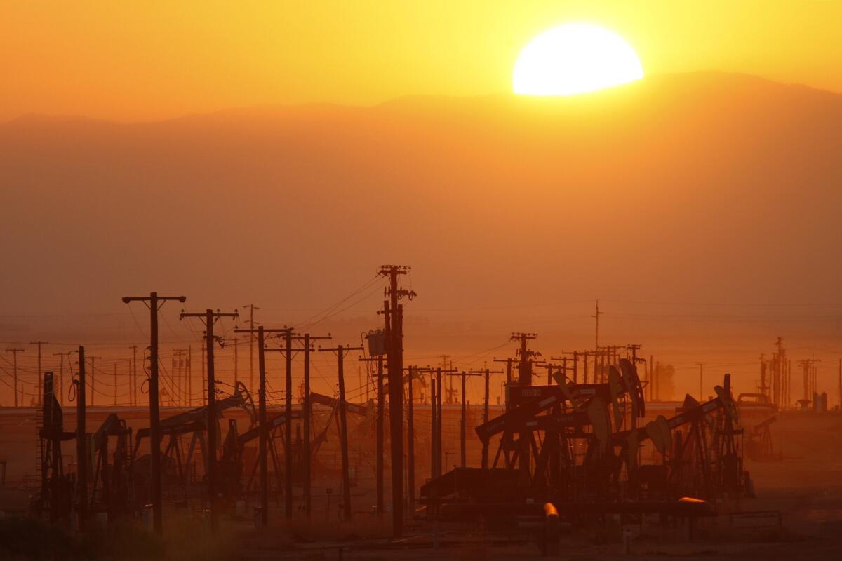 LOST HILLS, CA - MARCH 24: The sun rises over an oil field over the Monterey Shale formation where gas and oil extraction using hydraulic fracturing, or fracking, is on the verge of a boom on March 24, 2014 near Lost Hills, California. Critics of fracking in California cite concerns over water usage and possible chemical pollution of ground water sources as California farmers are forced to leave unprecedented expanses of fields fallow in one of the worst droughts in California history. Concerns also include the possibility of earthquakes triggered by the fracking process which injects water, sand and various chemicals under high pressure into the ground to break the rock to release oil and gas for extraction though a well. The 800-mile-long San Andreas Fault runs north and south on the western side of the Monterey Formation in the Central Valley and is thought to be the most dangerous fault in the nation. Proponents of the fracking boom saying that the expansion of petroleum extraction is good for the economy and security by developing more domestic energy sources and increasing gas and oil exports.
