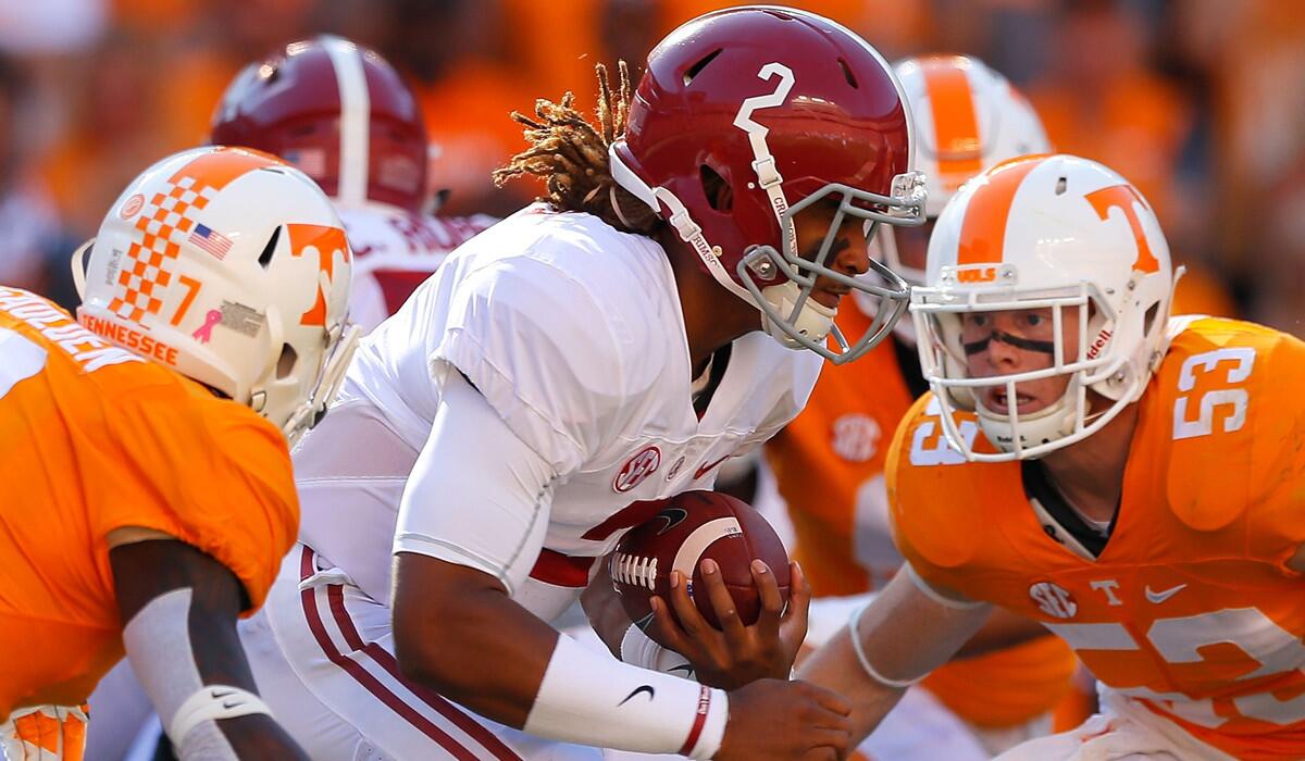 Alabama freshman quarterback Jalen Hurts rushes against Tennessee's Rashaan Gaulden (7) and Colton Jumper (53) during the game Oct. 15.