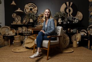 Alicia Wallace, co-founder and COO of All Across Africa, the parent company of Kazi, poses in the showroom at National City on Monday, March 21, 2022. The San Diego-based company works with artisans across Africa to create handmade products while also paying them fair wages.