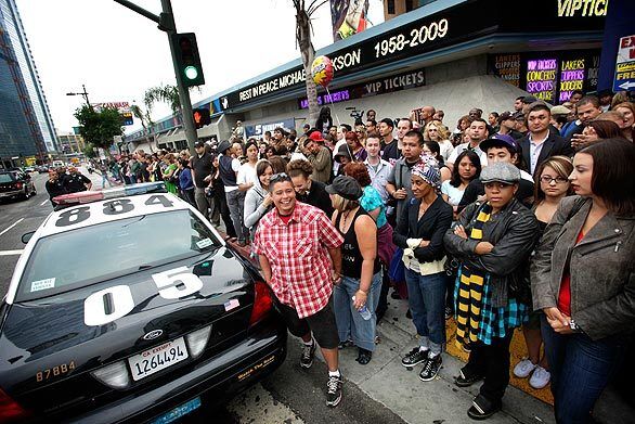 Fans wait until 7 a.m. to make their way across Olympic Boulevard at Figueroa Street for the Michael Jackson memorial at Staples Center in downtown Los Angeles. Only those with tickets and wristbands got in.