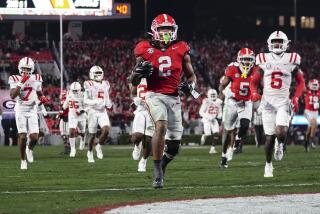 Georgia running back Kendall Milton (2) runs for a touchdown against Mississippi during the second half of an NCAA college football game, Saturday, Nov. 11, 2023, in Athens, Ga. (AP Photo/John Bazemore)