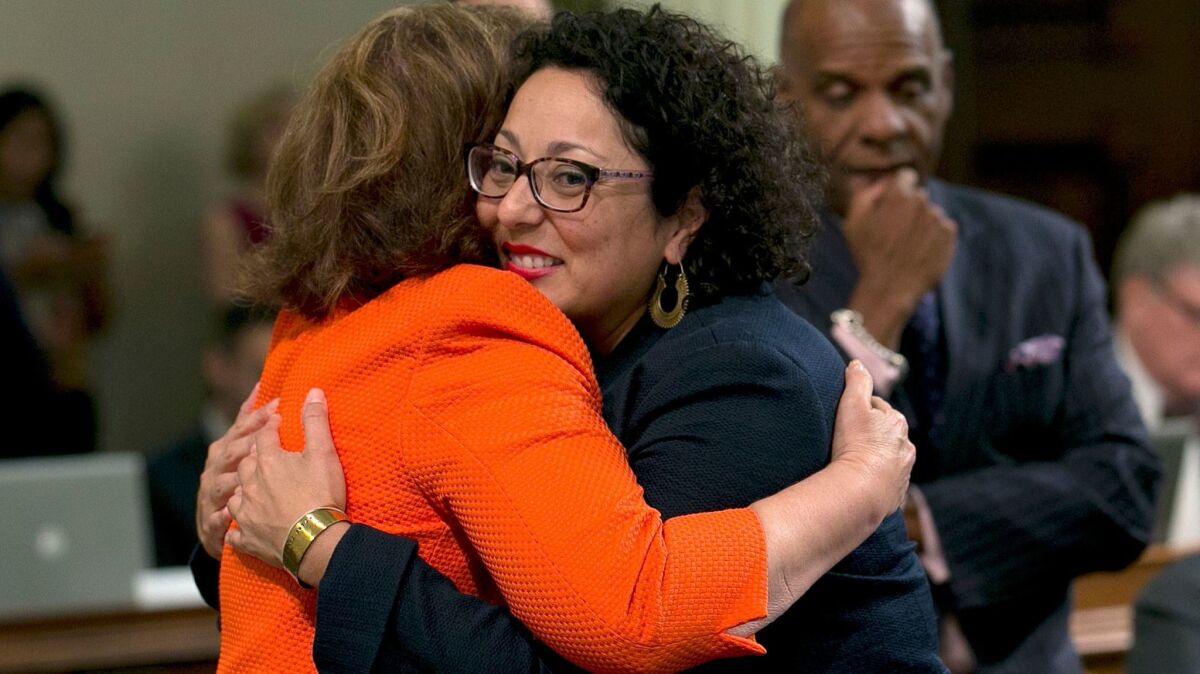 Assemblywoman Cristina Garcia (D-Bell Gardens) is congratulated after lawmakers pass air quality legislation this month.