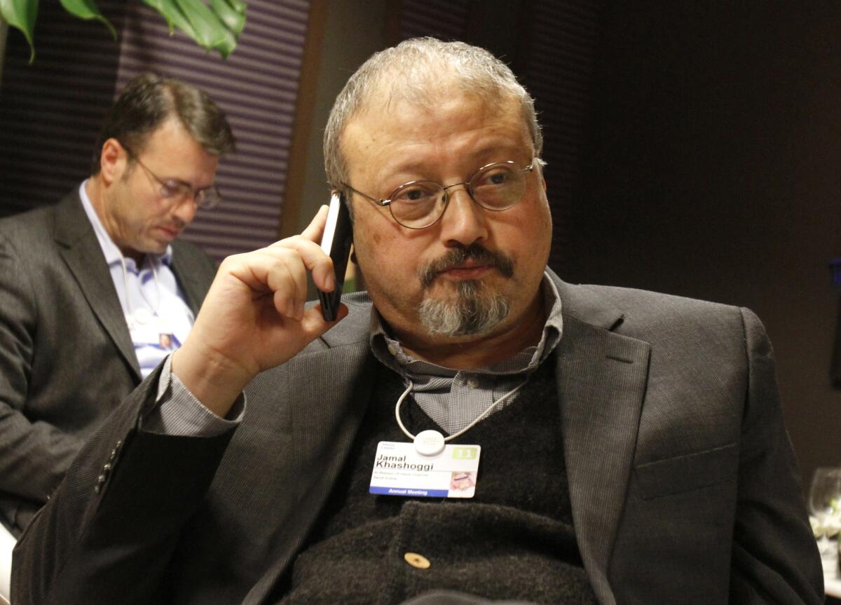 FILE - In this Jan. 29, 2011, file photo, Saudi Arabian journalist Jamal Khashoggi speaks on his cellphone at the World Economic Forum in Davos, Switzerland. In recent months, the Trump administration has repeatedly put off the release of its long-awaited Mideast peace plan. Now, the death of Saudi journalist Jamal Khashoggi at the hands of Saudi agents may put the plan into a deep freeze. (AP Photo/Virginia Mayo, File)