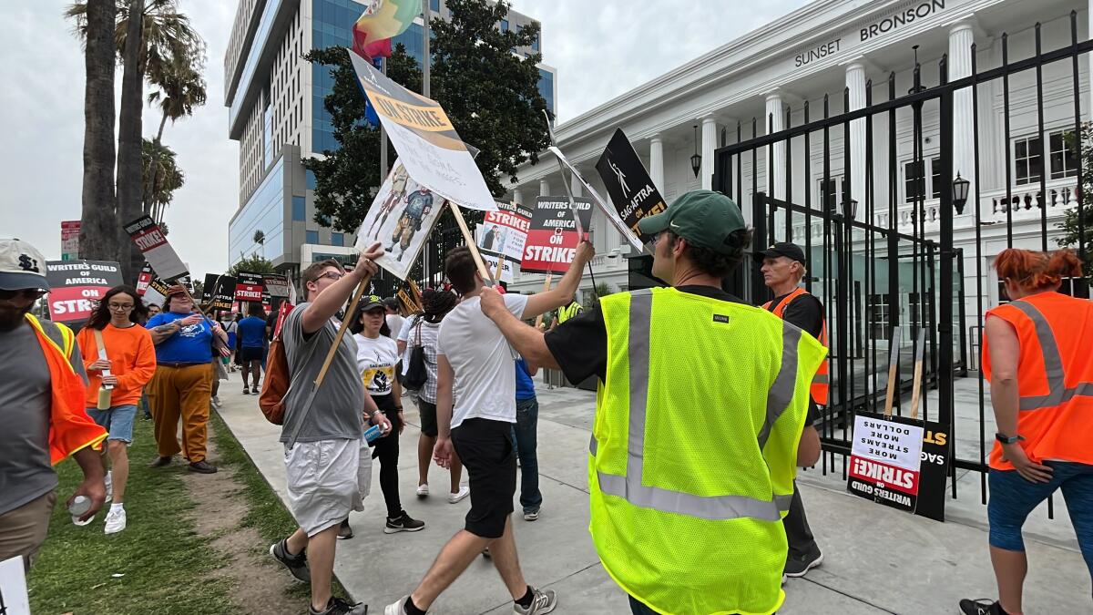 Hollywood workers picket outside Netflix in Los Angeles.