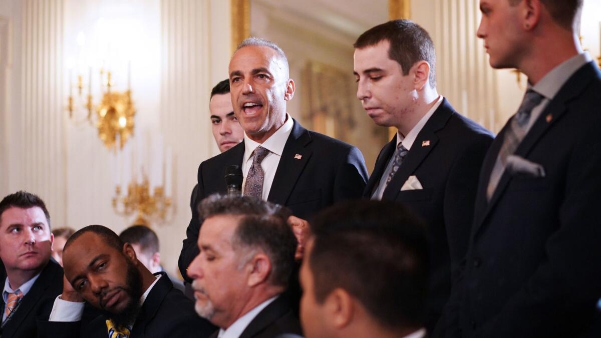 Andrew Pollack, flanked by his sons, speaks during a visit to the White House last year.