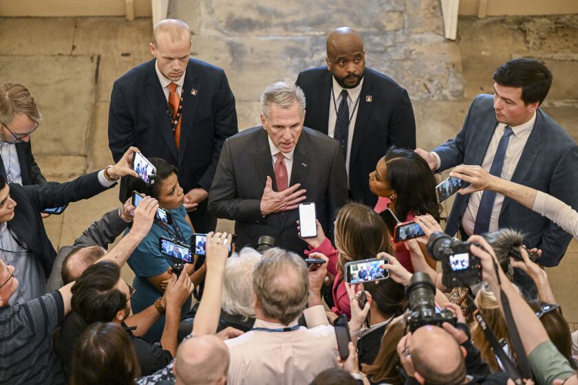 House Speaker Kevin McCarthy (R-Calif.) speaks to reporters about debt limit negotiations as he arrives at the Capitol in Washington, May 25, 2023. (Kenny Holston/The New York Times)