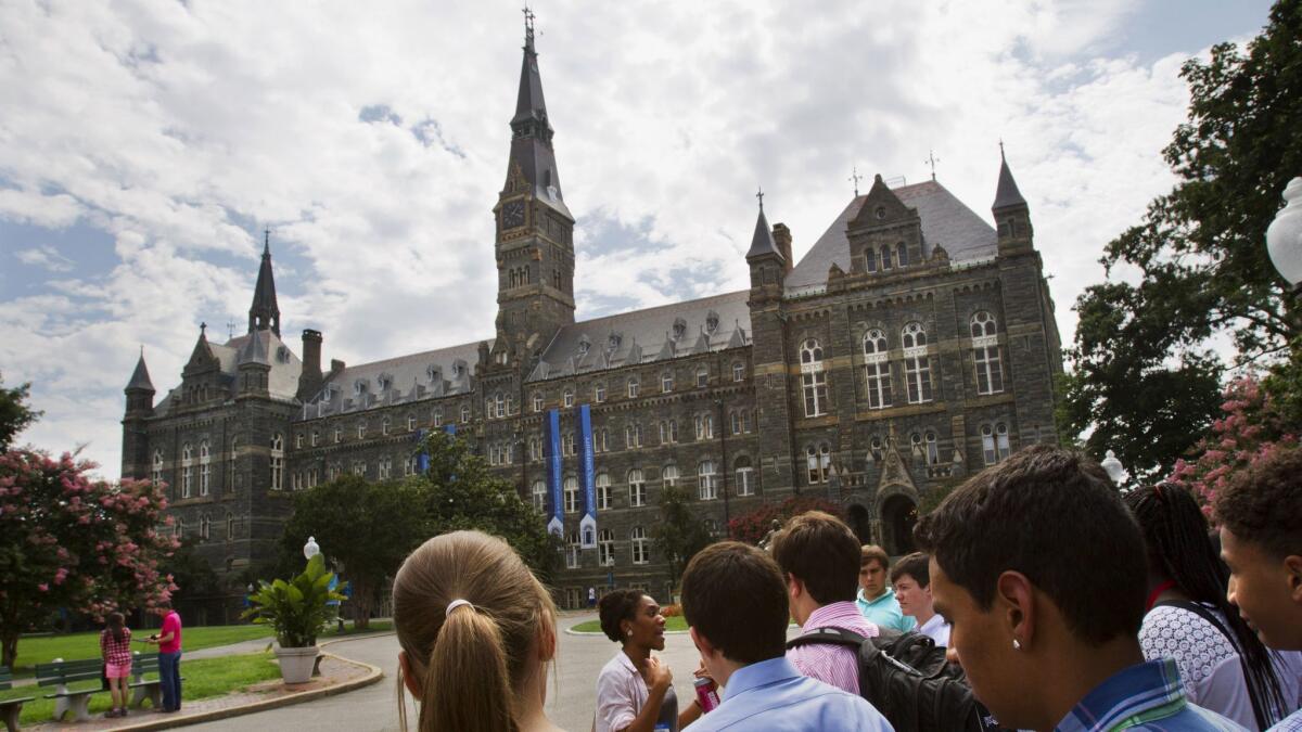 Prospective students tour Georgetown University's campus in Washington on July 10, 2013.