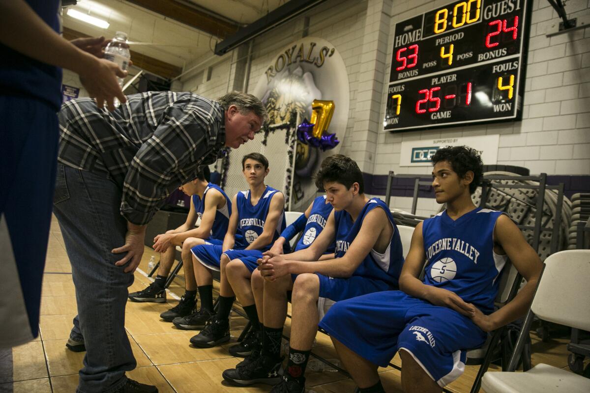 Down 29 points early in the fourth quarter, Lucerne Valley coach David Carroll tries to encourage players to continue playing hard.