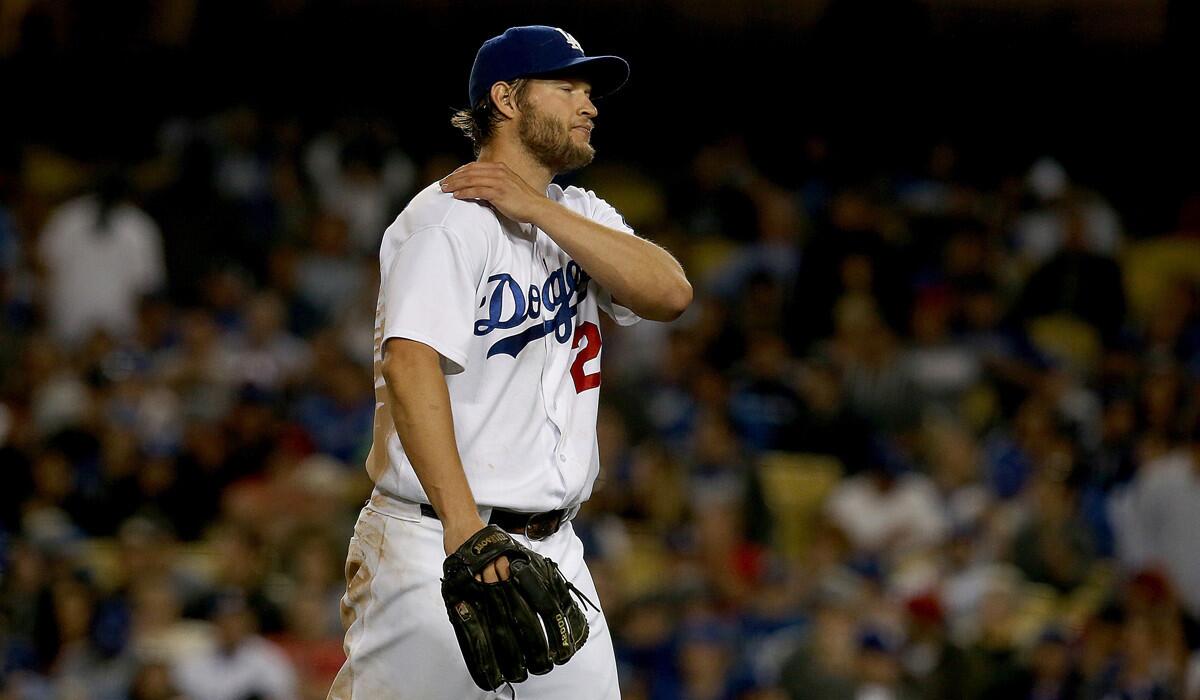 Dodgers pitcher Clayton Kershaw walks off the field after the eighth innng on Tuesday at Dodger Stadium.