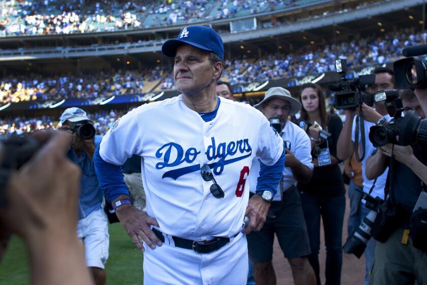 Joe Torre takes it all in after his last home game as Dodgers manager, in 2010.