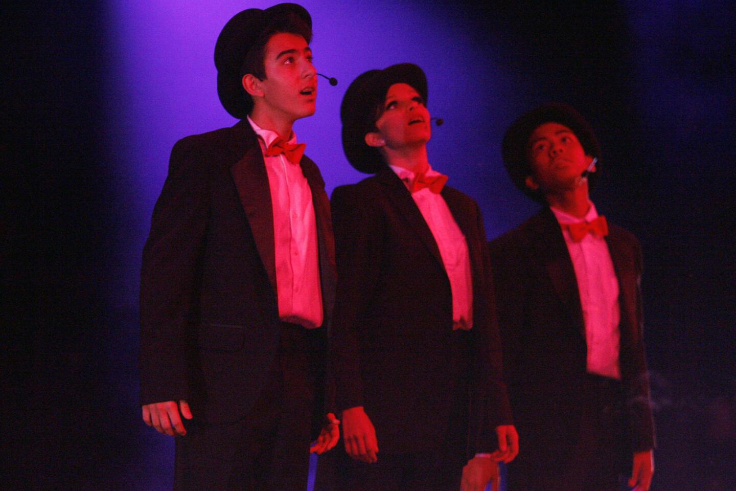 Nick Nikoian, from left, Samantha Rubin and Marvin de la Cruz perform onstage during a John Burroughs High School Vocal Music Assn. performance, "Burroughs on Broadway," which took place at John Burroughs High School in Burbank on Friday, October 12, 2012.