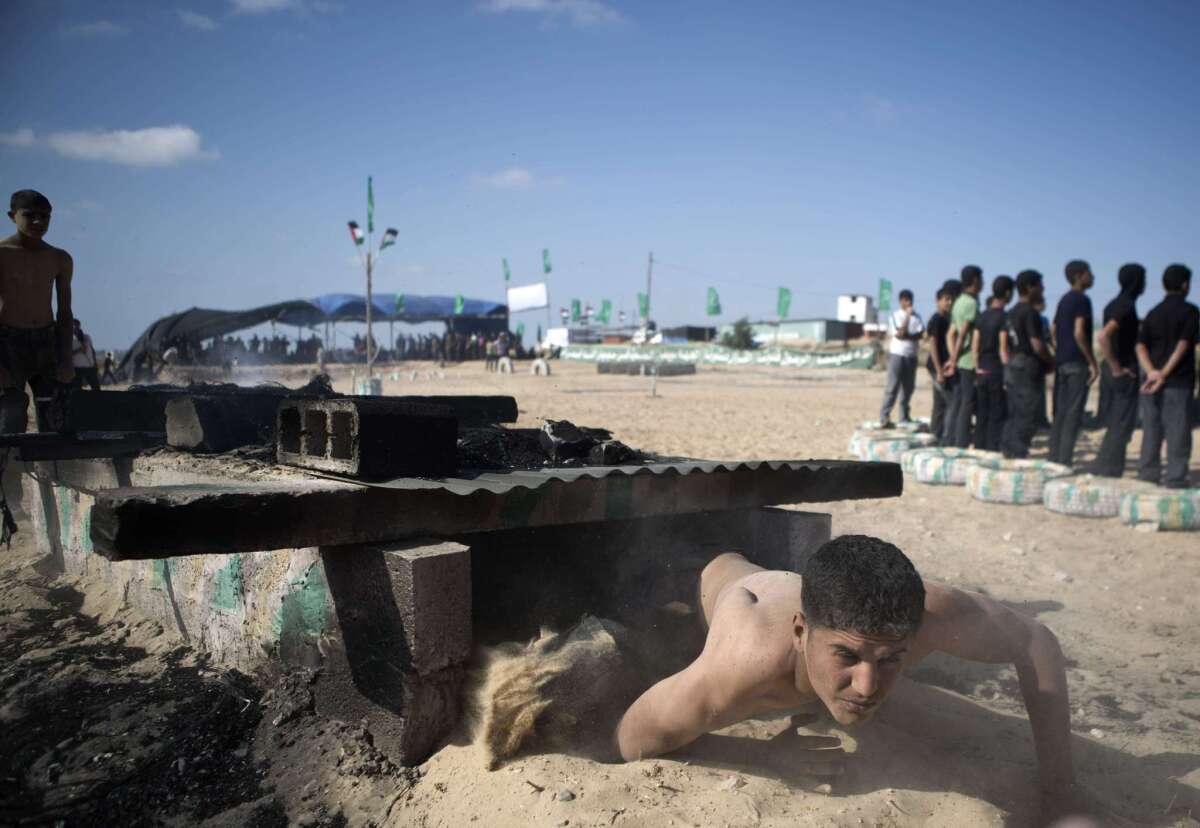 Palestinian youths take part in a summer camp organized by Hamas in Rafah in the Gaza Strip on Monday.