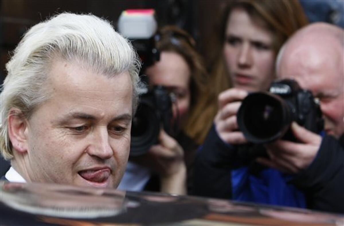 Dutch politician Geert Wilders is photographed as he leaves a press conference in London, Friday, March 5, 2010. Dutch anti-Islam politician Geert Wilders has returned to Britain, seizing the media spotlight and stirring up protest after winning a local election in the Netherlands. (AP Photo/Kirsty Wigglesworth)