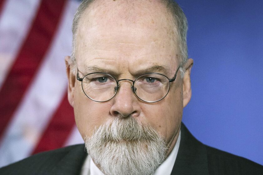 FILE - This 2018 portrait released by the U.S. Department of Justice shows Connecticut's U.S. Attorney John Durham. Attorney General William Barr has given extra protection to the prosecutor he appointed to investigate the origins of the Russia investigation, giving him the authority of a special counsel to allow him to complete his work without being easily fired. Barr told The Associated Press on Dec. 1, 2020, that he appointed Durham as a special counsel in October under the same federal statute that governed special counsel Robert Mueller’s in the Russia probe. (U.S. Department of Justice via AP, File)