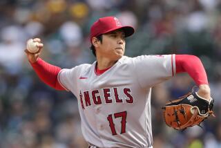 Los Angeles Angels starting pitcher Shohei Ohtani throws against the Seattle Mariners.