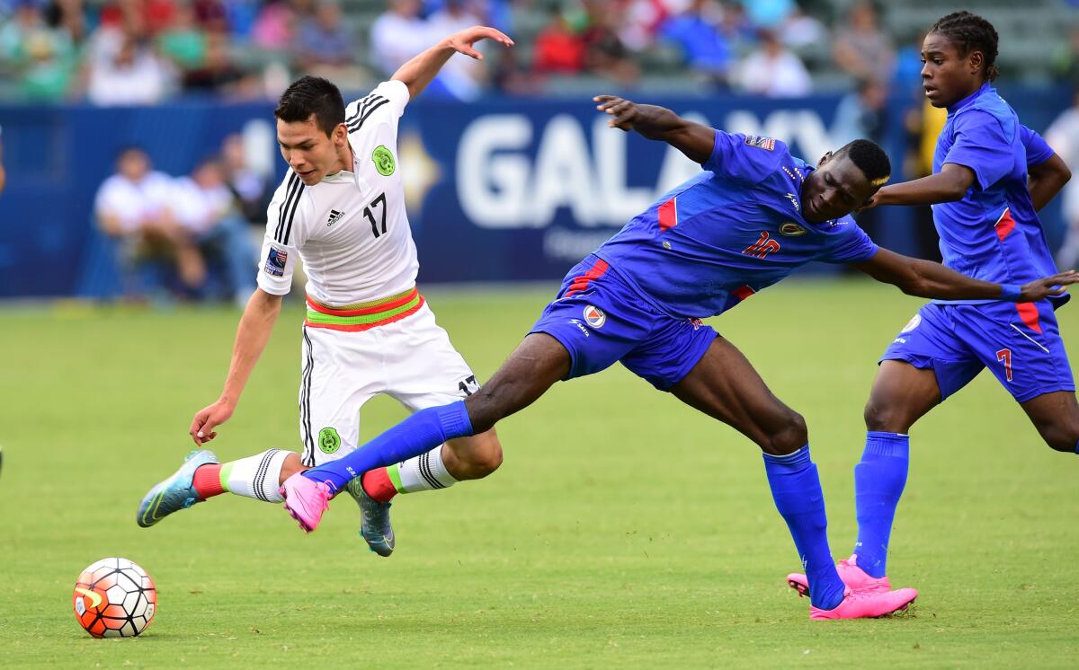 Hirving Lozano (#17) of Mexico vies for the ball with Woodensky Cherenfant (#10) of Haiti on October 4, 2015 in Carson, California during their CONCACAF Men's Olympic qualifying match where Mexico defeated Haiti 1-0. AFP PHOTO / FREDERIC J. BROWNFREDERIC J. BROWN/AFP/Getty Images ** OUTS - ELSENT, FPG, CM - OUTS * NM, PH, VA if sourced by CT, LA or MoD **