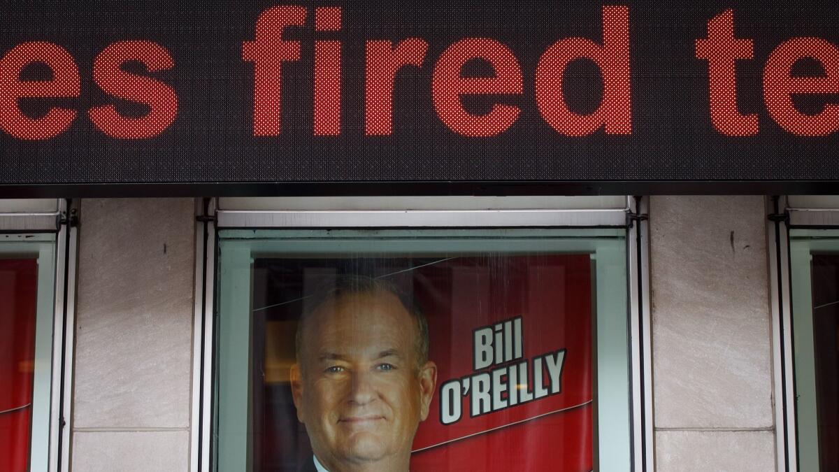 Advertisements for Fox News and Bill O'Reilly outside News Corp. and Fox News headquarters in New York City on Wednesday.