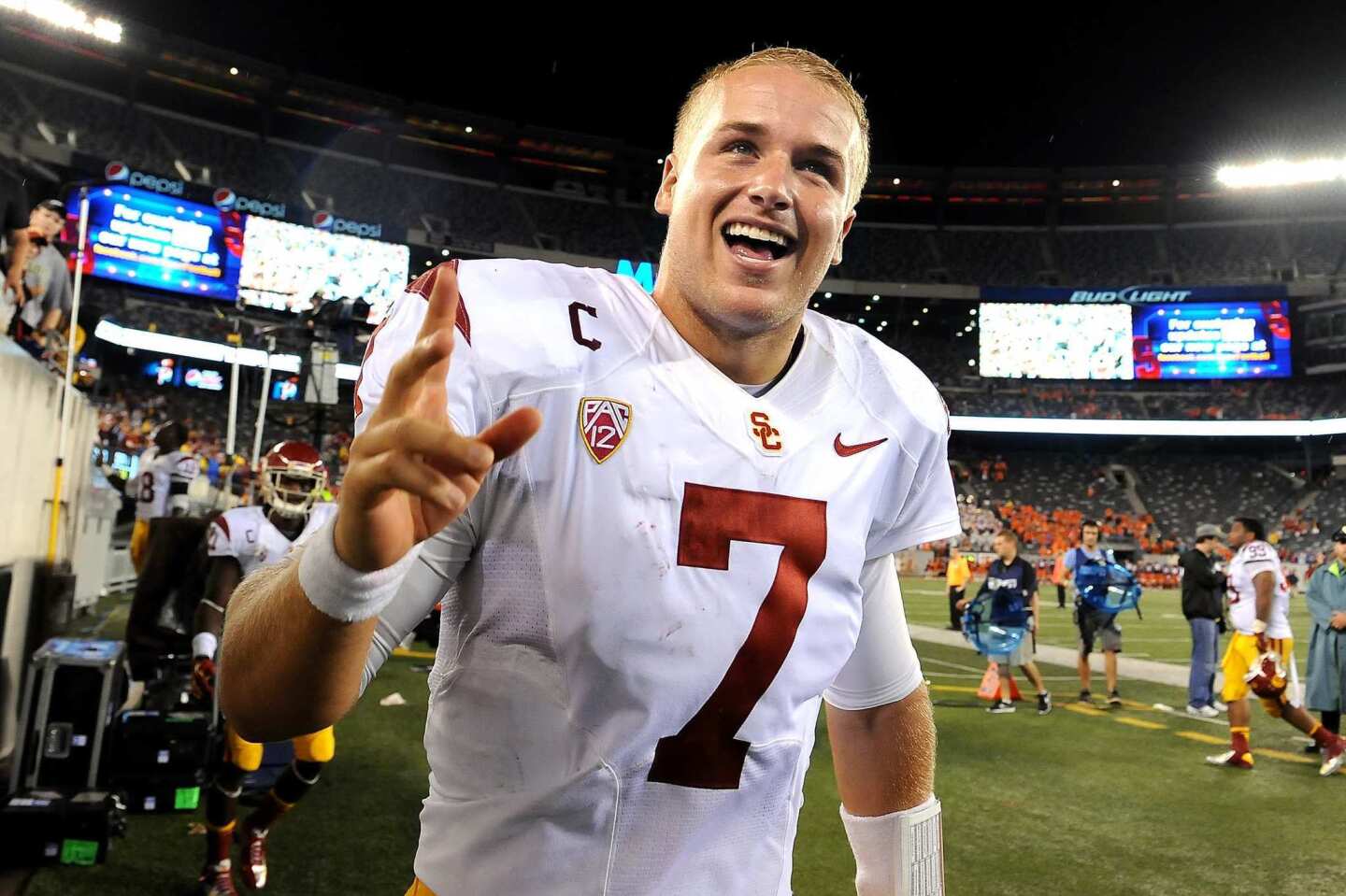USC quarterback Matt Barkley celebrates with fans after the 42-29 victory over Syracuse on Saturday.