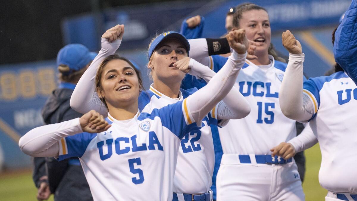 UCLA players celebrate after winning the regional against Missouri at Easton Stadium on Sunday. On Friday, the Bruins beat James Madison in Game 1 of their super regional.
