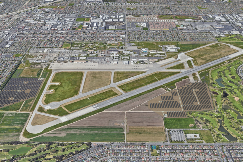 An aerial rendering shows proposed fields of solar panels on both sides of Los Alamitos Army Airfield.