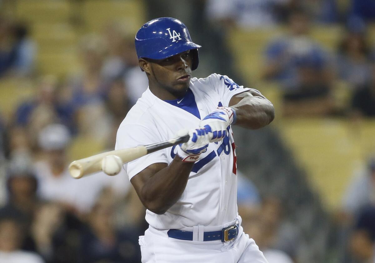 Yasiel Puig grounds out against San Diego during the fifth inning of the Dodgers' 2-1 over the Padres on Saturday at Dodger Stadium.