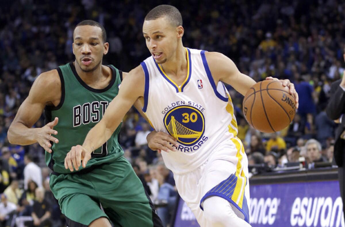Golden State Warriors point guard Steve Curry, right, drives past Boston Celtics guard Avery Bradley during the a game on Jan. 10. Curry is part of a new generation of NBA stars that will play a prominent role in the league for years to come.